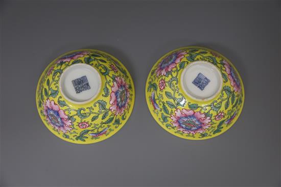 A pair of Chinese yellow ground famille rose bowls, Daoguang six character seal mark and probably of the period (1821-50), Diam.11.5cm